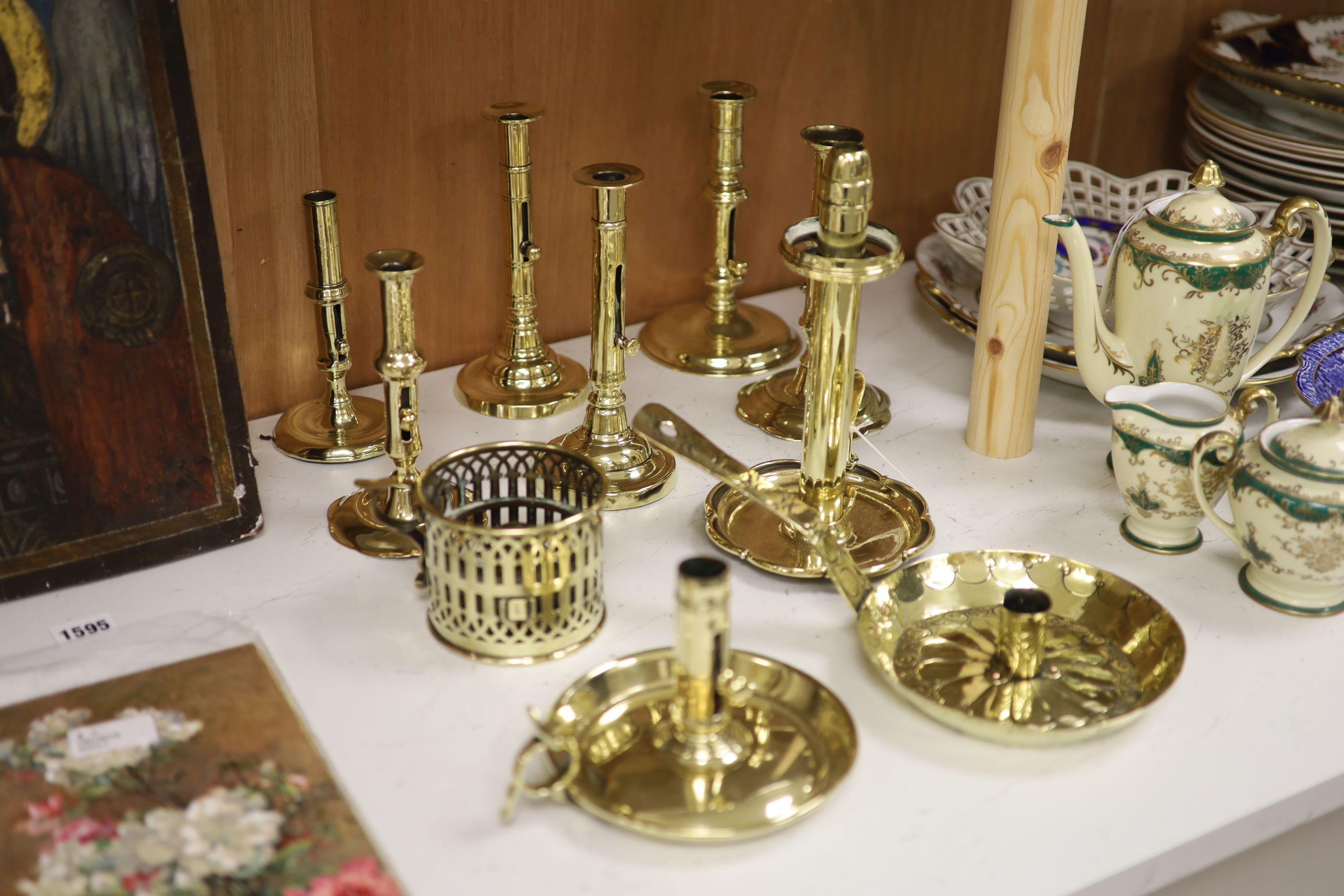 A quantity of 18th/19th century brass ejector candlesticks together with chambersticks, tallest 24cm